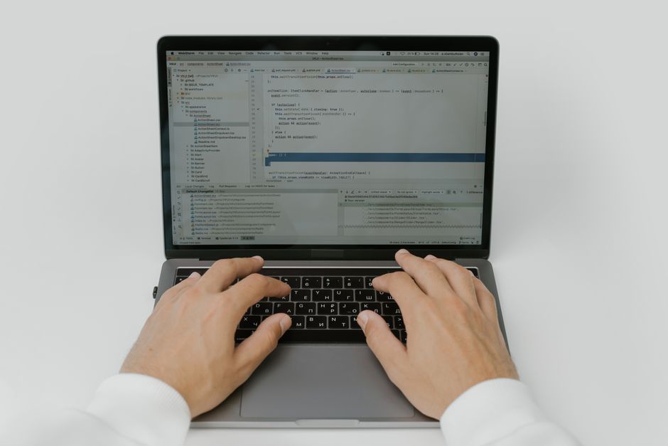 developer programming on computer screen