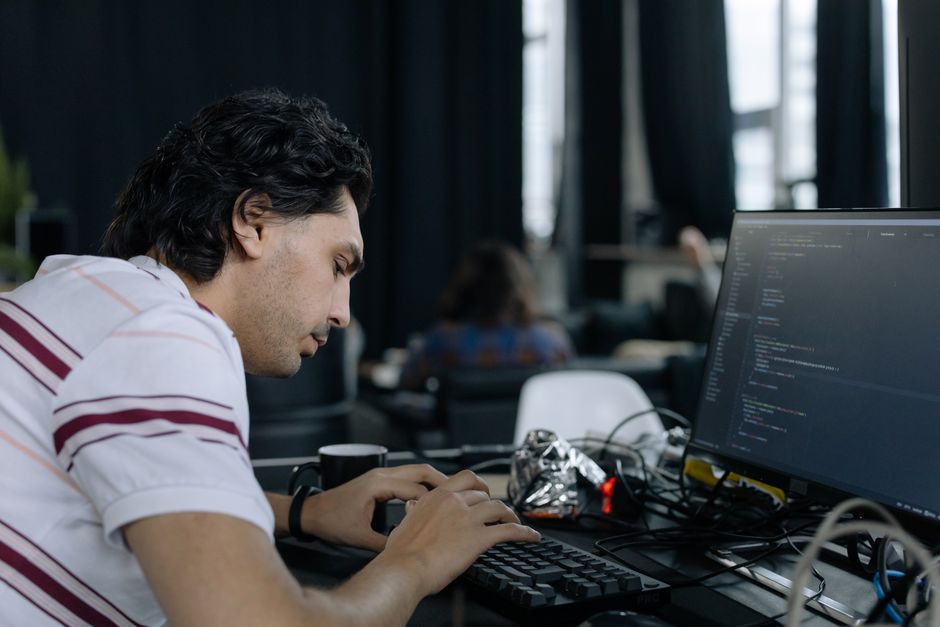 developer typing code at computer